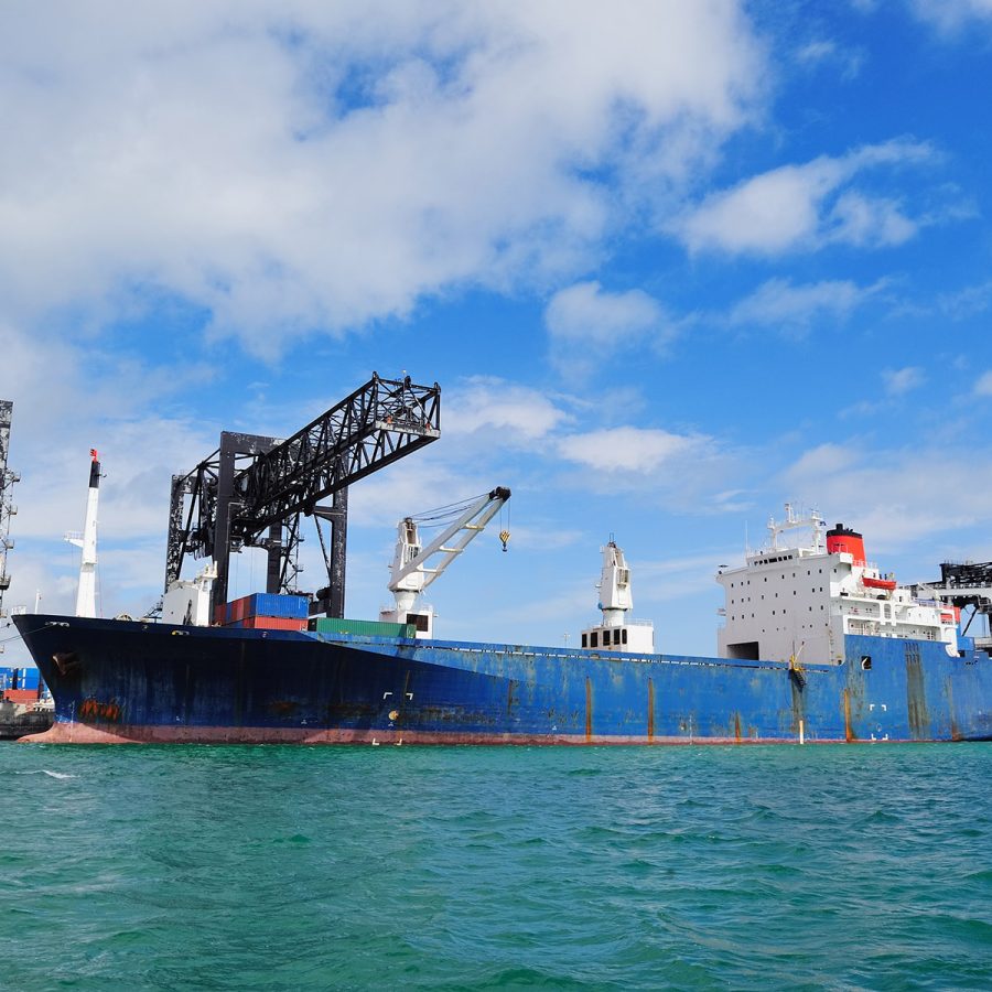 cargo-ship-miami-harbor-with-crane-blue-sky-sea